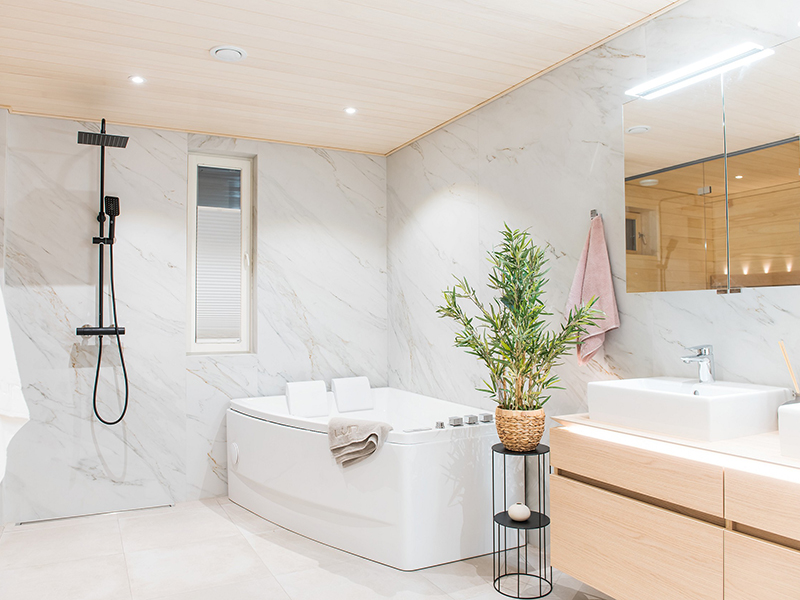 Light-toned atmospheric bathroom with a bathtub