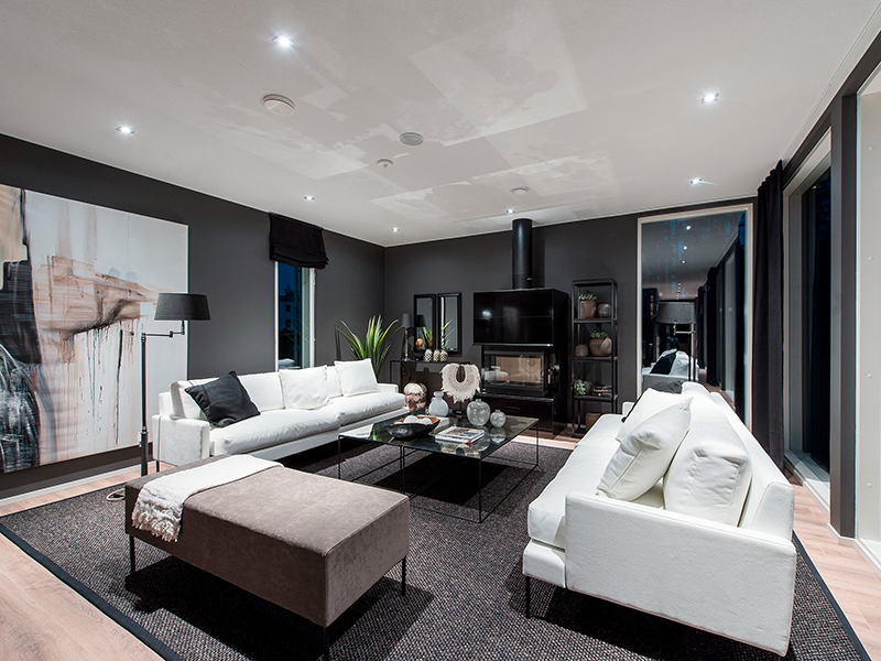 Dark-toned living room with multiple light sources